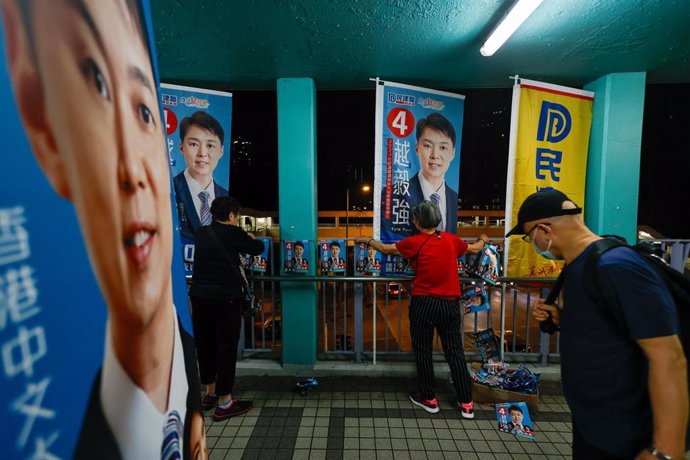 December 10, 2023, Hong Kong, Hong Kong, Hong Kong: Workers are seen putting up election flags for a pro-Beijing candidate on the polling day, as the city holds its ''patriots-only'' District Council Election, amid crackdowns on democracy by China. Acco