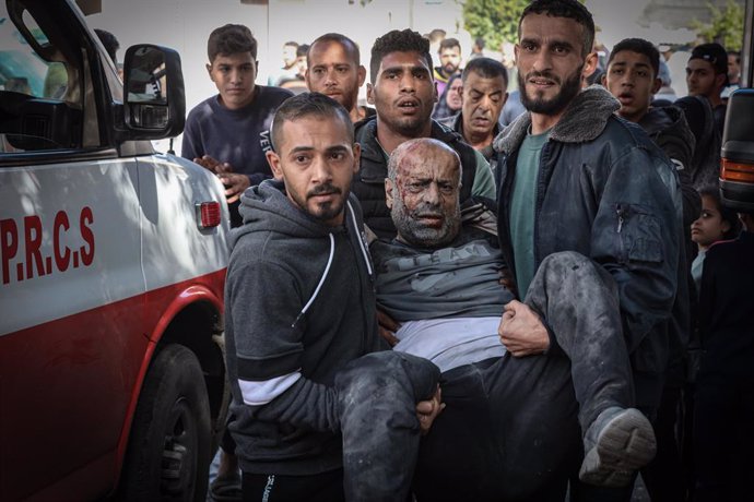 December 8, 2023, Khan Yunis, Gaza Strip, Palestinian Territories:  An injured Palestinian man is taken to the hospital after the Israeli bombing. Israeli warplanes bombed a residential house in the Al-Amal neighborhood, west of Khan Yunis Governorate, so