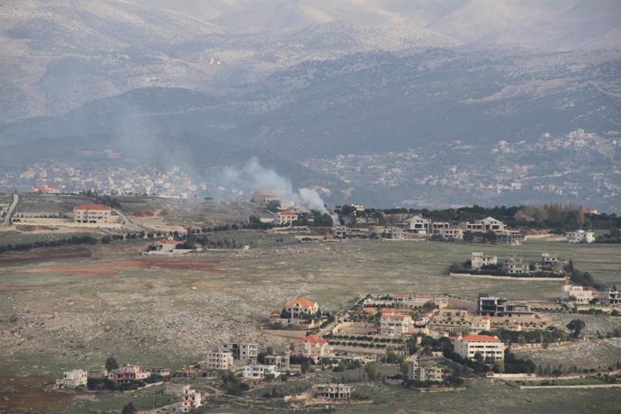 KHIAM, Dec. 8, 2023  -- Smoke rises following an Israeli shelling in Khiam, Lebanon, on Dec. 8, 2023. Four Hezbollah fighters and two members of the Palestinian Islamic Jihad (PIJ) movement were killed on Friday in confrontations on the Lebanese-Israeli b