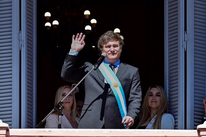 BEIJING, Dec. 12, 2023  -- Argentina's new President Javier Milei waves to the crowd from the balcony of the Casa Rosada Presidential Palace in Buenos Aires, Argentina, Dec. 10, 2023. Javier Milei, a liberal politician and economist, assumed the Argentine