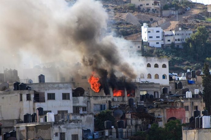 December 13, 2023, Jenin, Palestine: Smoke rises from a Palestinian house in the Jenin refugee camp after it was targeted by the Israeli army. During a military operation inside Jenin camp searching for militants. Violence has escalated in the Palestinian
