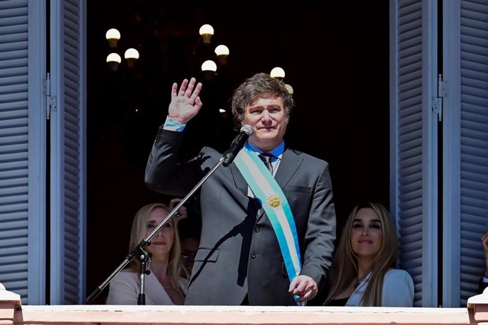 BEIJING, Dec. 12, 2023  -- Argentina's new President Javier Milei waves to the crowd from the balcony of the Casa Rosada Presidential Palace in Buenos Aires, Argentina, Dec. 10, 2023. Javier Milei, a liberal politician and economist, assumed the Argenti