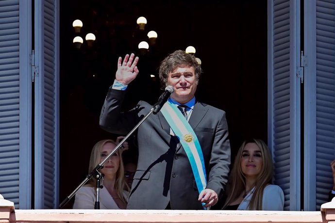 BEIJING, Dec. 12, 2023  -- Argentina's new President Javier Milei waves to the crowd from the balcony of the Casa Rosada Presidential Palace in Buenos Aires, Argentina, Dec. 10, 2023. Javier Milei, a liberal politician and economist, assumed the Argentine