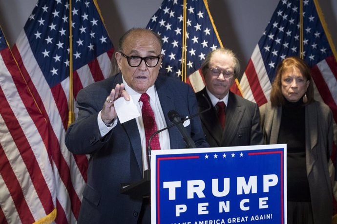 Archivo - November 19, 2020, USA: Former Mayor Rudy Giuliani (Republican of New York, New York) holds up an example of what he calls voter fraud as he conducts a press conference at Republican National Committee headquarters in Washington, DC on Thursday,