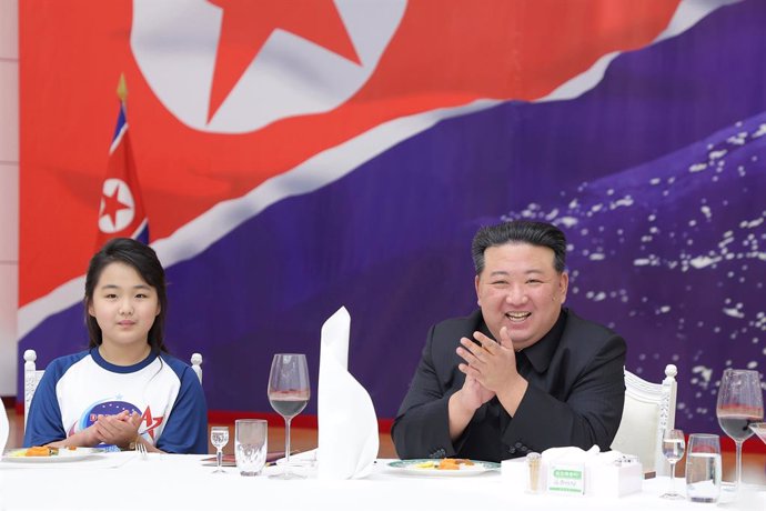 23 November 2023, North Korea, Pyongyang: A picture released by the North Korean state news agency (KCNA) on 24 November 2023 shows North Korean leader Kim Jong-un (R), alongside his daughter Ju-ae, attends a reception at the Mokran House, to celebrate 