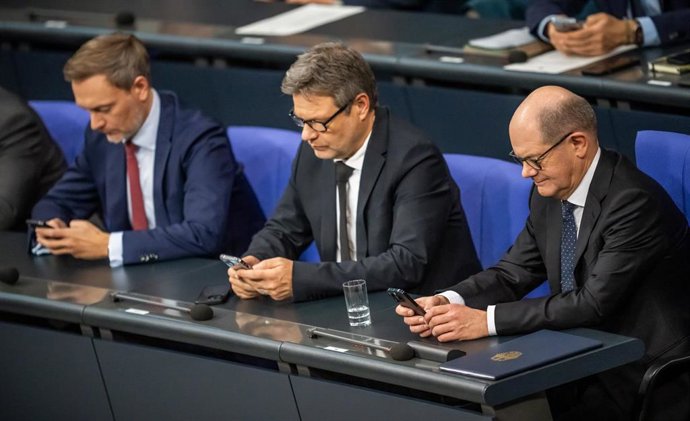 13 December 2023, Berlin: (L-R) Christian Lindner, Germany's Finance Minister, Robert Habeck, Economy Minister, and German Chancellor Olaf Scholz take part in a plenary session of the German Bundestag. Photo: Michael Kappeler/dpa