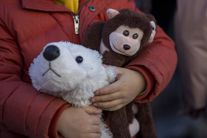 December 16, 2023, Madrid, Madrid, Spain: Activists with Palestinian flags place stuffed animals and dolls in front of the Spanish Congress of Deputies, during an action for the children who have died in Gaza, during the war against Israel.