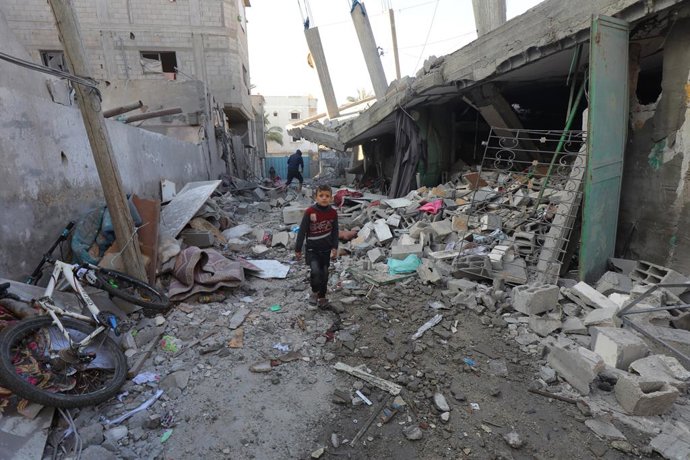 December 30, 2023, Nuseirat, Gaza Strip, Palestinian Territory: Residents and civil defense teams conduct search and rescue operation under the rubbles following an Israeli attack on Al-Wawi family building in Nuseirat Camp, Gaza Strip, on December 30, 