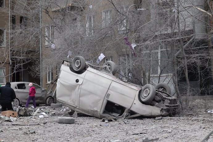 December 8, 2023, Kharkiv, Ukraine: KHARKIV, UKRAINE - DECEMBER 8, 2023 - An overturned van rests on its roof after a Russian missile attack on Kharkiv, northeastern Ukraine. As reported, on Friday night, Russian troops struck Kharkiv with allegedly S-300