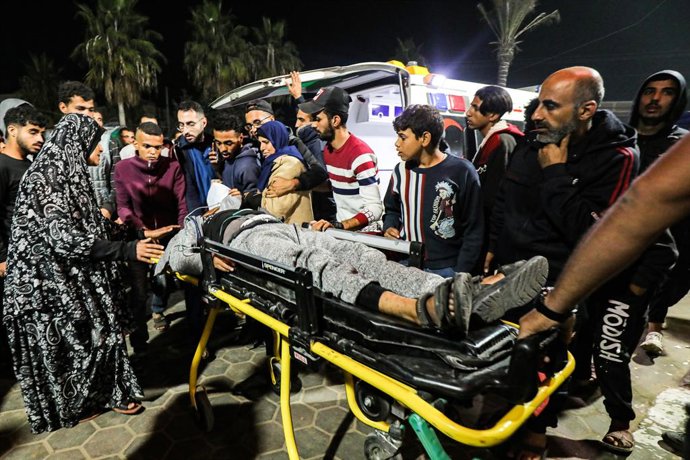 December 30, 2023, Dair El-Balah, Gaza Strip, Palestinian Territory: Palestinians injured in Israeli air strikes is transferred to Al-Aqsa Hospital on December 30, 2023 in Dair El-Balah, Gaza. More than 20,000 Palestinians in Gaza have been killed since