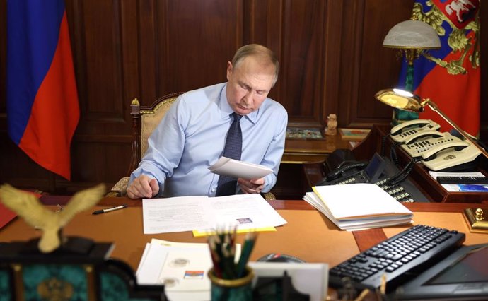 December 27, 2023, Moscow, Moscow Oblast, Russia: Russian President Vladimir Putin speaks by phone with  Nikita Miroshnichenko, an 11-year-old boy from Kostroma region, who took part in the New Year Tree of Wishes charity campaign from the Kremlin, Decemb