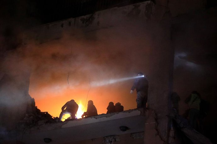 BEIRUT, Jan. 2, 2024  -- Rescuers work at an apartment belonging to the Hamas movement destroyed by an Israeli attack on the southern suburb of Beirut, Lebanon, on Jan. 2, 2024. A Hamas source told Xinhua that the movement's deputy chief, Saleh al-Arour