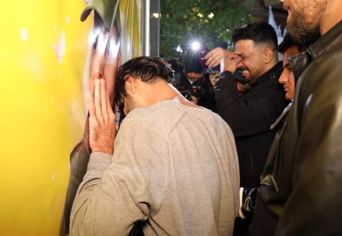 BAGHDAD, Jan. 4, 2024  -- People mourn during the funeral of three members of Iraqi paramilitary Hashd Shaabi forces killed in a drone attack, in Baghdad, Iraq, on Jan. 4, 2024. Three members of Iraqi paramilitary Hashd Shaabi forces were killed and five 