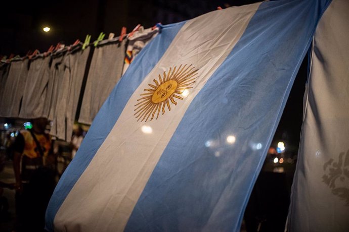December 23, 2023, Buenos Aires, Buenos Aires, Argentina: Argentine flag accompanies the demonstration in front of the National Congress
