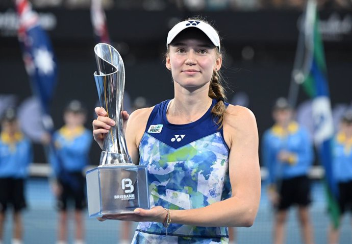 Elena Rybakina of Kazakhstan  celebrates winning with the trophy against Aryna Sabalenka of Belarus during the women’s Final on Day 8 of the 2024 Brisbane International at the Queensland Tennis Centre in Brisbane, Sunday, January 7, 2024. (AAP Image/Darre