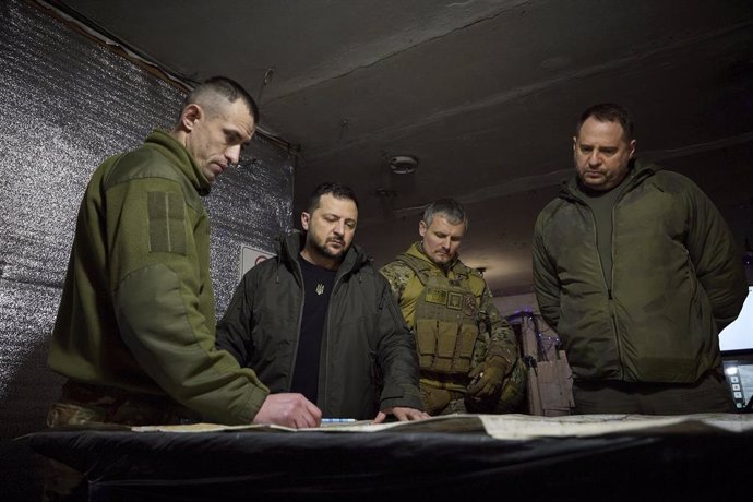 December 29, 2023, Avdiivka, Donetsk Oblast, Ukraine: Ukrainian President Volodymyr Zelenskyy, center, is briefed by brigade commander Mykola Chumak, left, during a visit to the 110th Separate Mechanized Brigade along the frontlines of the Donetsk regio