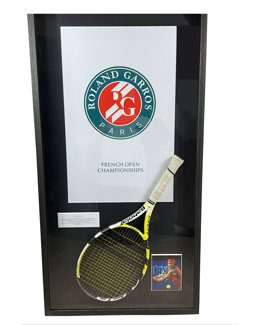 Rafael Nadal's championship point winning racket from his 2007 French Open Final victory over Roger Federer, in custom framing. The racket comes with a Resolution Photomatch document, forensically confirming it was the very racket which won the final po