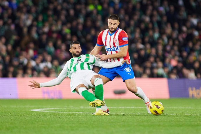 Willian Jose of Real Betis and David Lopez of Girona FC in action during the Spanish league, La Liga EA Sports, football match played between Real Betis and Girona FC at Benito Villamarin stadium on December 21, 2023, in Sevilla, Spain.