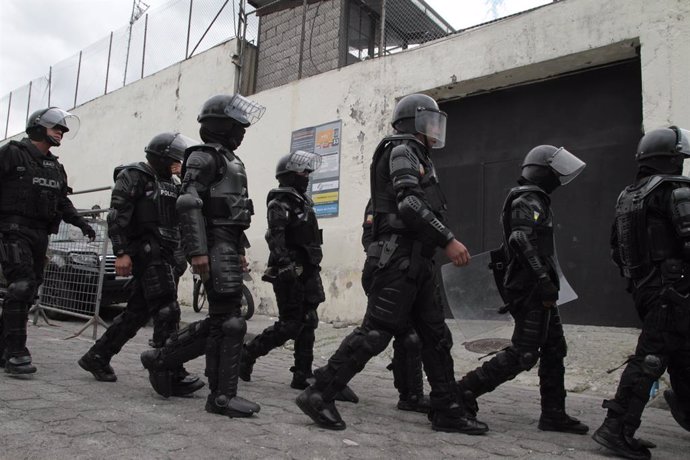 QUITO, Jan. 10, 2024  -- Ecuadorian police patrol in Quito, Ecuador, Jan. 9, 2024. Ecuadorian President Daniel Noboa on Tuesday declared "internal armed conflict" and mobilized the army to combat organized crime linked to drug trafficking, following an 