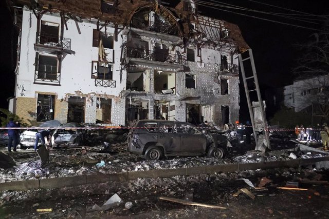 January 11, 2024, Kharkiv, Ukraine: Destroyed cars and a three-story hotel building were damaged by a Russian missile attack in Kharkiv, north-eastern Ukraine.