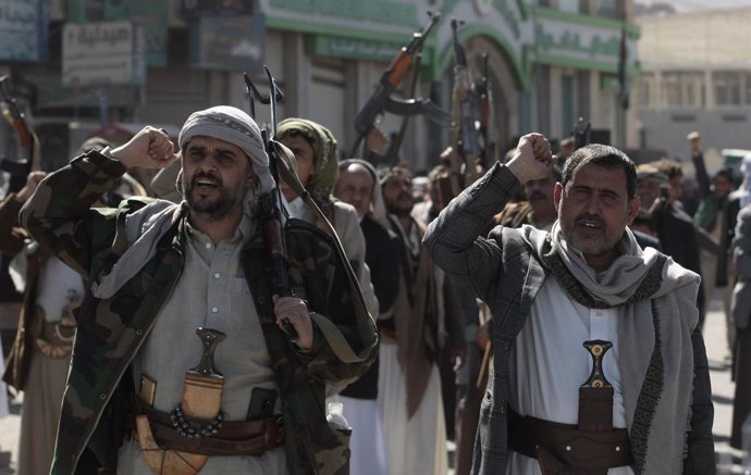 January 11, 2024, Sanaa, Sanaa, Yemen: Newly recruited Houthi fighters hold up a weapons and chanting slogans in a ceremony at the end of their training in Sanaa, Yemen..The head of Yemen's Houthi movement, Abdul-Malik al-Houthi, has cautioned the Unite