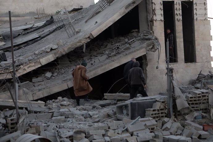 HEBRON, Jan. 22, 2024  -- People check the rubble of a building, demolished by Israeli forces, in the West Bank city of Hebron, Jan. 21, 2024.   Israeli Prime Minister Benjamin Netanyahu on Sunday rejected a proposal of a ceasefire deal reportedly being a