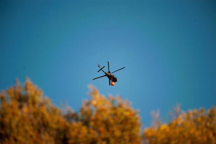 January 24, 2024, Bogota, Cundinamarca, Colombia: Colombia's aerospacial airforce UH-16 Blackhawk helicopter helps mitigating the fire as smoke rises from a wildfire in Bogota's eastern mountains , wildfires rose to 5 during January 24, 2024, after hot te