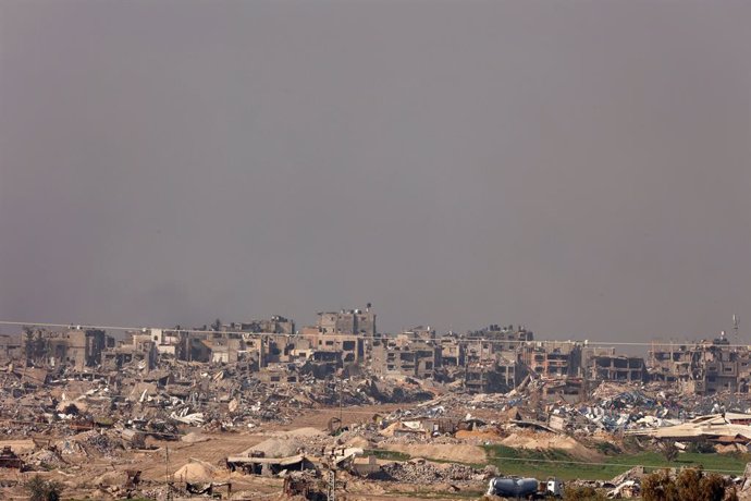 ISRAEL-GAZA BORDER, Jan. 18, 2024  -- Photo taken on Jan. 18, 2024 shows the damaged buildings in the Gaza Strip as seen from southern Israel. Israeli Prime Minister Benjamin Netanyahu said Thursday that his country will maintain security control over the
