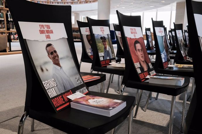 January 31, 2024, Jerusalem, Israel: An installation commemorating the 136 Israeli hostages, still believed to be in Hamas captivity in the Gaza Strip, is displayed at the National Library of Israel. Chairs bear photos of the hostages, each with a book pe