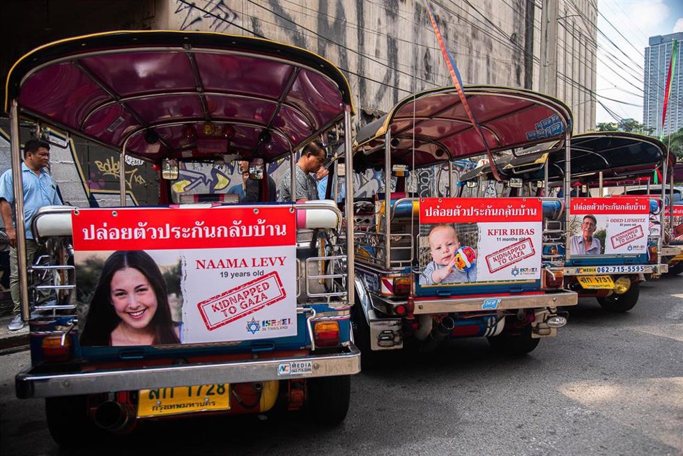 January 12, 2024, Bangkok, Thailand: Portraits of people who were kidnapped to Gaza with a Thai message that says ''Free Hostages to Home Now'' are seen hanging on the auto-rickshaws during a campaign ''Bring Them Home Now'' at the Embassy of Israel in