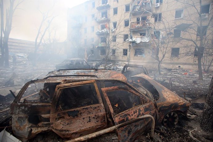 January 23, 2024, Kharkiv, Ukraine: KHARKIV, UKRAINE - JANUARY 23, 2024 - A burnt-out car is seen outside a destroyed residential building after the Russian missile attack on Kharkiv, northeastern Ukraine. As reported, the Russian missile strike which too