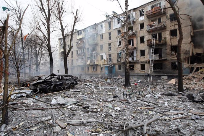 January 23, 2024, Kharkiv, Ukraine: KHARKIV, UKRAINE - JANUARY 23, 2024 - Debris covers the ground around a burnt-out car and outside a destroyed residential building after the Russian missile attack on Kharkiv, northeastern Ukraine. As reported, the Russ