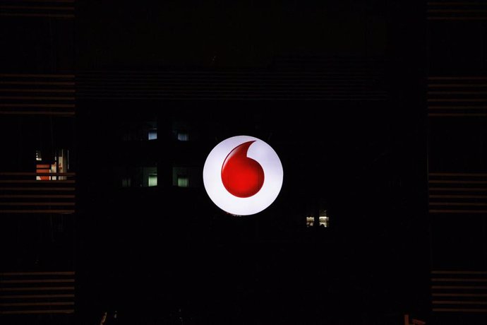 Archivo - Logo de la empresa de Vodafone encendido, a 10 de agosto de 2022, en Madrid (España). 