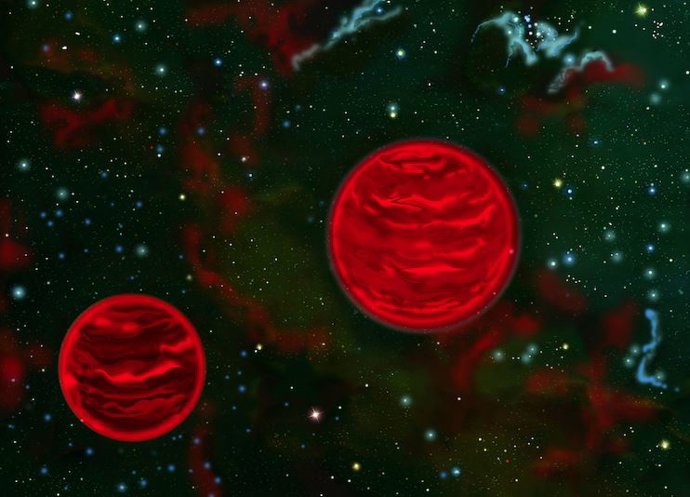 Los objetos binarios con masa de Júpiter que flotan libremente son comunes incluso cuando la teoría estelar y planetaria actual no puede explicar su existencia. Representación artística de uno de estos sistemas, no a escala.