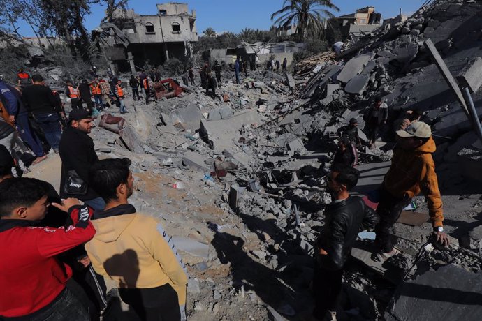 February 15, 2024, Zawaida, Gaza Strip, Palestinian Territory: Palestinians inspect the wreckage of the destroyed buildings and the area after an Israeli attack that continues in Zawaida of Gaza on February 15, 2024