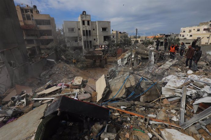 February 18, 2024, Zawaida, Gaza Strip, Palestinian Territory: Palestinians inspect the wreckage of the destroyed buildings and the area after an Israeli attack that continues in Zawaida of Gaza Strip on February 18, 2024