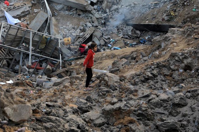 GAZA, Feb. 20, 2024  -- A girl is seen among the rubble after an Israeli airstrike in the Nuseirat refugee camp, central Gaza Strip, on Feb. 20, 2024. At least 12 Palestinians were killed on Tuesday during an Israeli attack on a residential square in the 