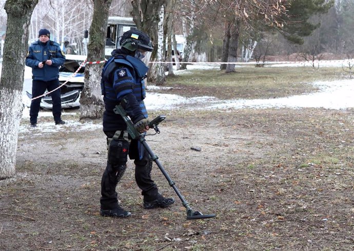 February 6, 2024, Kyiv Region, Ukraine: KYIV REGION, UKRAINE - FEBRUARY 6, 2024 - A deminer scans the ground with a metal detector at one of the locations of the National Academy of Internal Affairs, Kyiv region, northern Ukraine.