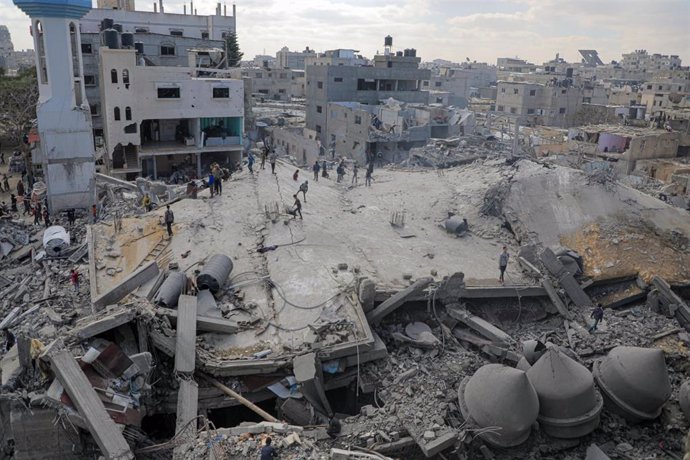 GAZA, Feb. 22, 2024  -- People gather at the site of an Israeli airstrike in the southern Gaza Strip city of Rafah, on Feb. 22, 2024. The Palestinian death toll from the ongoing Israeli attacks on Gaza has risen to 29,410, with 69,465 others wounded since