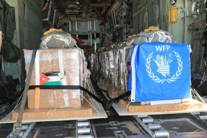 HANDOUT - 05 March 2024, ---: Humanitarian aid packages are seen on a plane before being dropped over Gaza. The landing operations included 3 C130 aircraft belonging to the Royal Jordanian Air Force, 3 American aircraft, an Egyptian aircraft, and a French