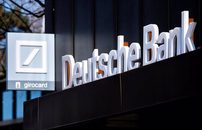 Archivo - FILED - 24 April 2021, Lower Saxony, Oldenburg: The Deutsche Bank logo hangs above the entrance at a branch in Oldenburg city center. 