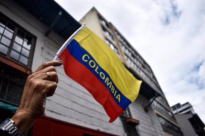 February 8, 2024, Bogota, Cundinamarca, Colombia: A person holds a Colombian flag during a demonstration demanding Colombia's Supreme Court to elect the countries new attorney general in Bogota, Colombia, February 8, 2024.