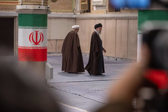 01 March 2024, Iran, Tehran: Iran's Supreme Leader Ayatollah Ali Khamenei  (r) walks next to his bureau chief Mohammed Mohammadi Golpajegani during the Iranian legislative election. Photo: Arne Bänsch/dpa