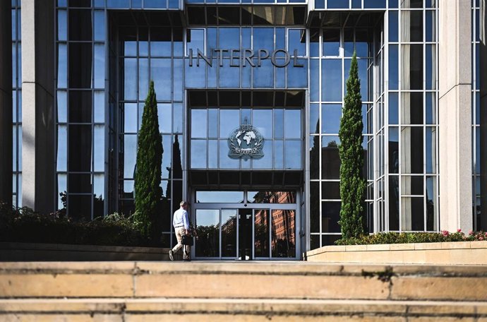 Archivo - 05 September 2023, France, Lyon: A man walks toward the entrance of the headquarters of the International Criminal Police Organization, known as Interpol. Interpol was founded in 1923 and celebrates its 100th anniversary this month. 