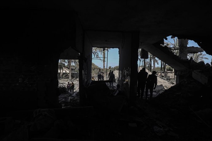 March 10, 2024, Deir Al-Balah, Gaza Strip, Palestinian Territory: Palestinian residents living in the area inspect the destroyed buildings after the Israeli attack on the Musa family building in Deir al-Balah, Gaza on March 10, 2024