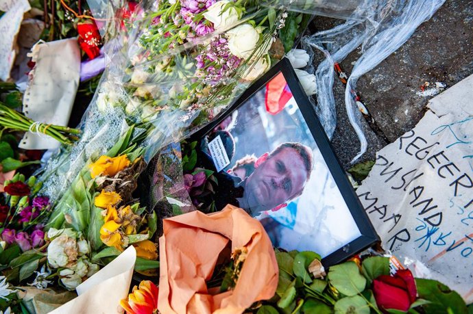 March 8, 2024, Amsterdam, Netherlands: A portrait of Alexei Navalny is seen surrounded by flowers and candles. Three weeks after the death of Russian opposition leader, lawyer, anti-corruption activist, and political prisoner Alexei Navalny, the memorial 