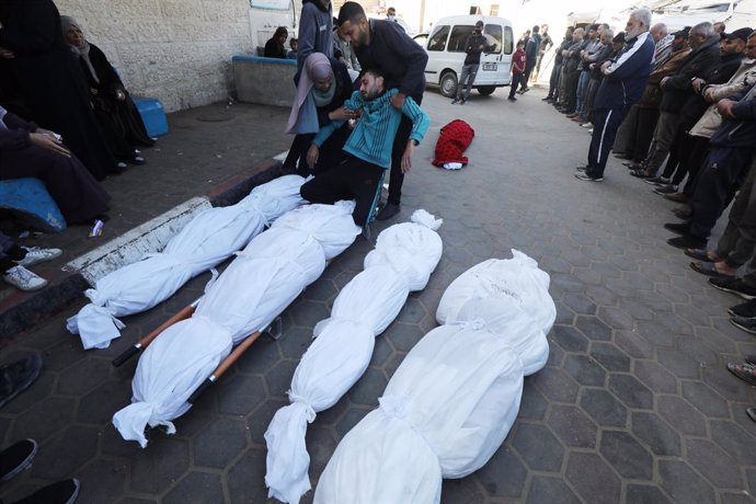 March 13, 2024, Dair El-Balah, Gaza Strip, Palestinian Territory: Relatives of the Palestinians died in Israeli attacks, mourn as they receive the dead bodies from the morgue of Al-Aqsa Hospital for burial in Dair El-Balah, Gaza on March 13, 2024