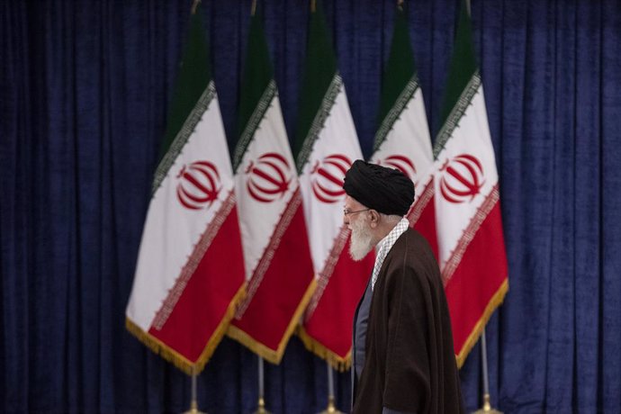 March 1, 2024, Tehran, Tehran, Iran: Iran's supreme leader Ayatollah Ali Khamenei walks past Iranian flags before casting his votes in the parliamentary elections and the elections for the Council of Experts on 01 March 2024, Iran, Tehran.