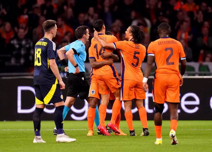 22 March 2024, Netherlands, Amsterdam: Netherlands' Tijjani Reijnders celebrates with team-mates after scoring his side's first goal of the game during the international friendly soccer match between the Netherlands and Scotland at the Johan Cruyff Arena.
