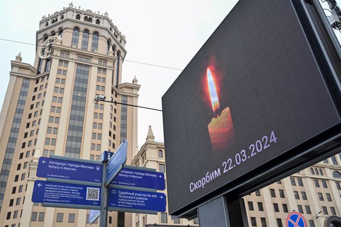 MOSCOW, March 23, 2024  -- This photo taken on March 23, 2024 shows a billboard displaying the image of a candle to mourn victims of a terrorist attack in Moscow, Russia. The death toll from Friday's terrorist attack has risen to 143 after gunmen stormed 